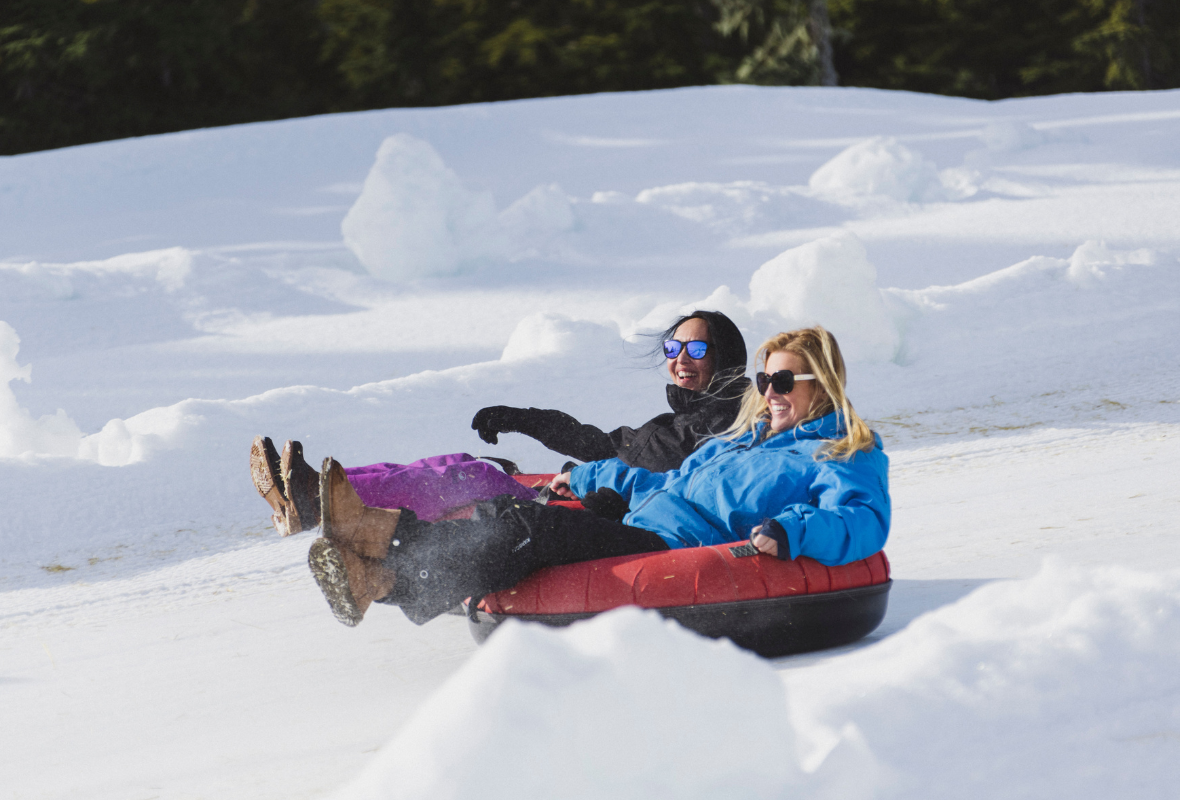 Adults tubing at the Mount Washington Tube Park